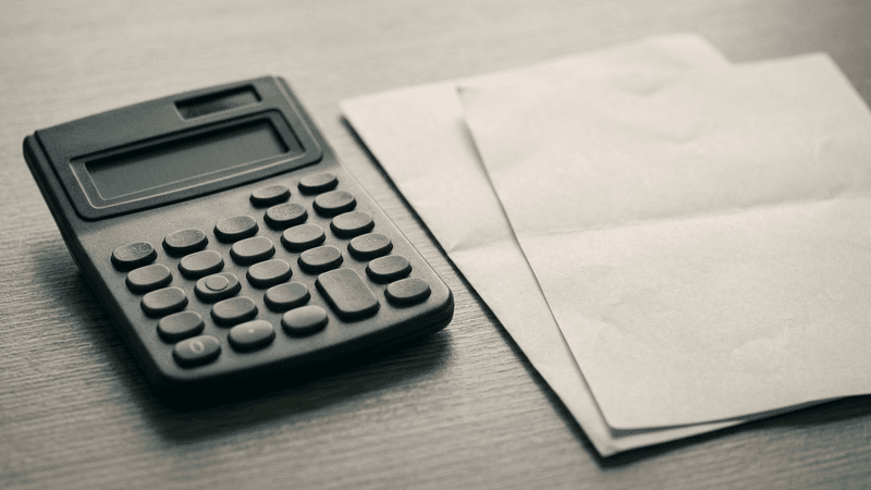 general legal: calculator beside printed financial statements on a desk